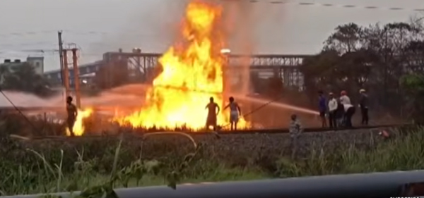 Petrochem fire spreads.