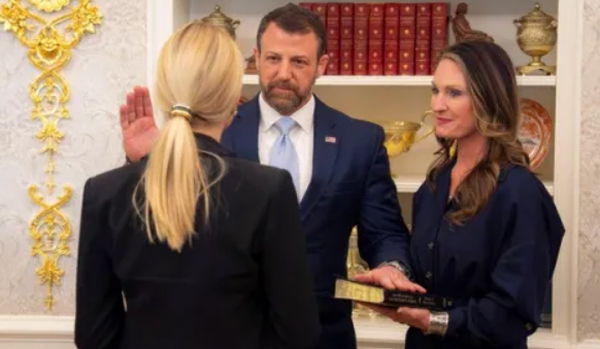 Mullin being sworn in DHS Secretary by Pam Bondi.