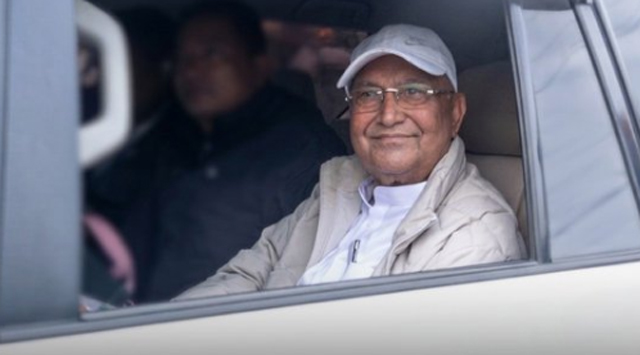 A smiling Oli after his arrest