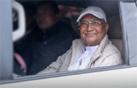 A smiling Oli after his arrest