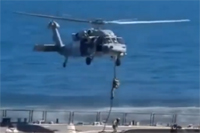 US marines rappelling on to Iranian ship.