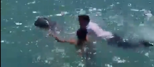 Cessna survivors swimming to safety.